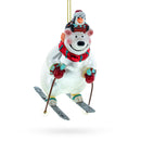 Bear and Penguin Skiing Glass Christmas Ornament