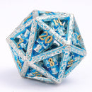 Skull's Grin Hollow Metal Dice Set - Glow in the Dark Blue
