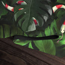 Snake Under Monstera Leaves Playmat