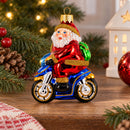 Santa on Motorcycle with Green Backpack Glass Christmas Ornament