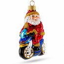 Santa on Motorcycle with Green Backpack Glass Christmas Ornament