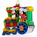 Playful Penguins Riding Train Glass Christmas Ornament