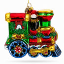 Playful Penguins Riding Train Glass Christmas Ornament