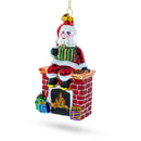 Santa Delivering Presents Down the Chimney Glass Christmas Ornament