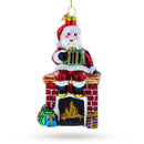 Santa Delivering Presents Down the Chimney Glass Christmas Ornament