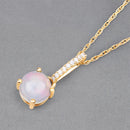 0.53 Carat Genuine Ethiopian Opal and White Diamond 10K Yellow Gold Pendant