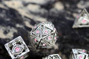 Dragon's Eye Hollow Metal Dice Set - Pink Gems