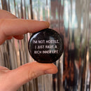 I'm Not Hostile I Just Have a Rich Inner Life 1.5" Button in Black and Tan