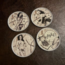 Sourpuss Nudie Coasters | Western Pin-Up Girls Set of Four | Metal & Cork Retro Round Drinkware with Tin