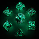 Skull's Grin Hollow Metal Dice Set - Glow in the Dark Blue