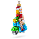 Girl Riding Scooter Glass Christmas Ornament