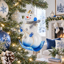 Snowman Riding a Sled Glass Christmas Ornament