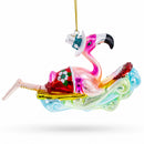 Pink Flamingo Riding a Surf Wave Glass Christmas Ornament