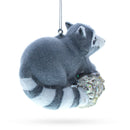 Playful Racoon on a Log Blown Glass Christmas Ornament