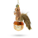 Playful Squirrel on Acorn Blown Glass Christmas Ornament