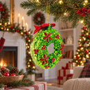 Holiday Wreath with Red Bow and Bells Glass Christmas Ornament