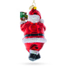 Santa Decorating the Train Blown Glass Christmas Ornament