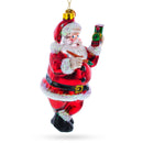Santa Decorating the Train Blown Glass Christmas Ornament