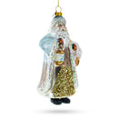 Glittered Santa Holding a Magical Lantern Blown Glass Christmas Ornament