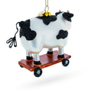 Spotted Cow Ice Skating Blown Glass Christmas Ornament