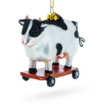 Spotted Cow Ice Skating Blown Glass Christmas Ornament