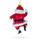 Santa Boogying in Festive Red Attire Glass Christmas Ornament