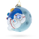 Astronaut on a Moon Blown Glass Christmas Ornament