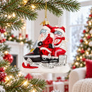 Retro Santa and Mrs. Claus on Snowmobile Glass Christmas Ornament
