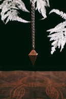 Green Glyphs Pendulum