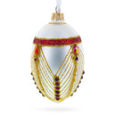 Red Jewels Eccentrics on White Glass Egg Ornament 4 Inches