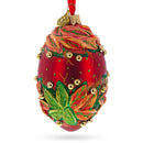 Red and Green Leaves on Red Glass Egg Ornament 4 Inches
