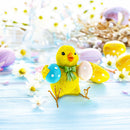 Cheerful Chick Clutching Colorful Easter Eggs Figurine